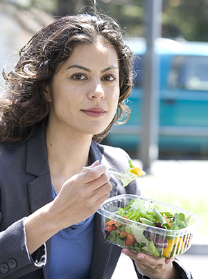 Person eating salad.